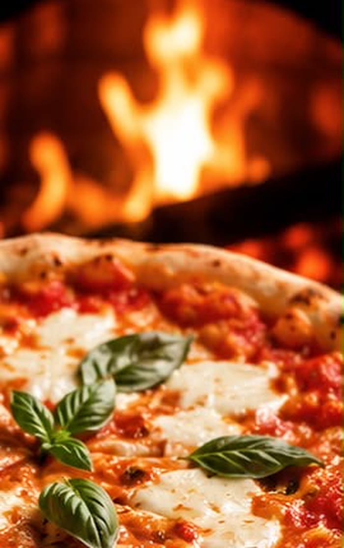 Pizza artesanal saliendo del horno de leña de Mambo Italiano